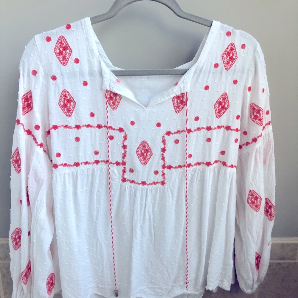 White tunic with coral stitching